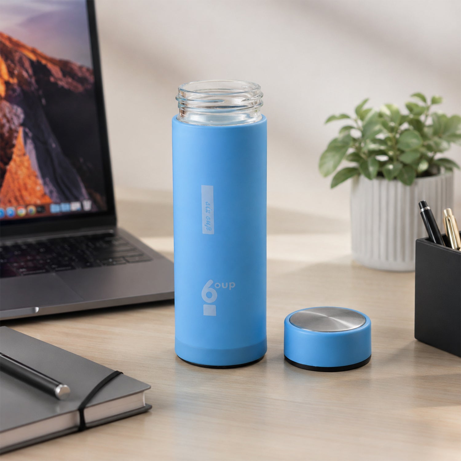 Glass drinking bottle with lid