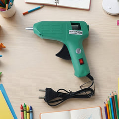 A hand holding the green 60 Watt hot melt glue gun, demonstrating its comfortable grip for DIY projects.