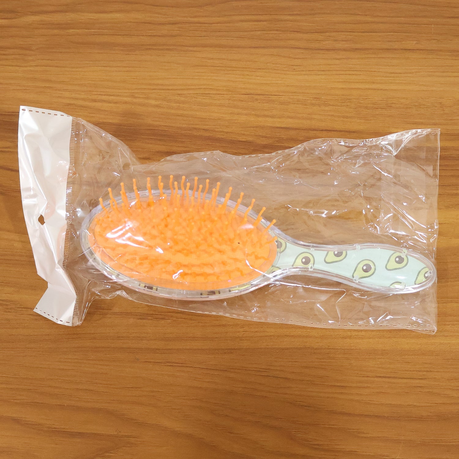 Soft cushion hair brush with flexible bristles and cushioned base