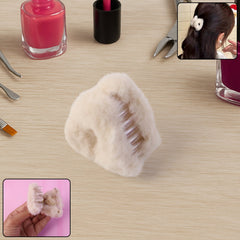 Fluffy plastic hair claw clip on white background