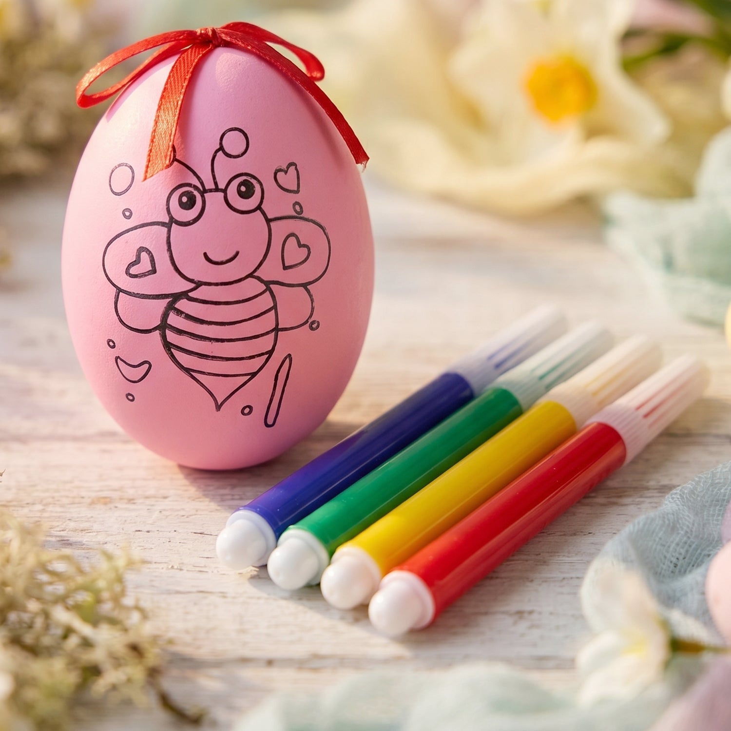 Set of color pens with decorative egg