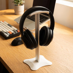 Headphones resting on the desktop stand