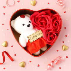 Open heart shaped gift box showing teddy bear and roses