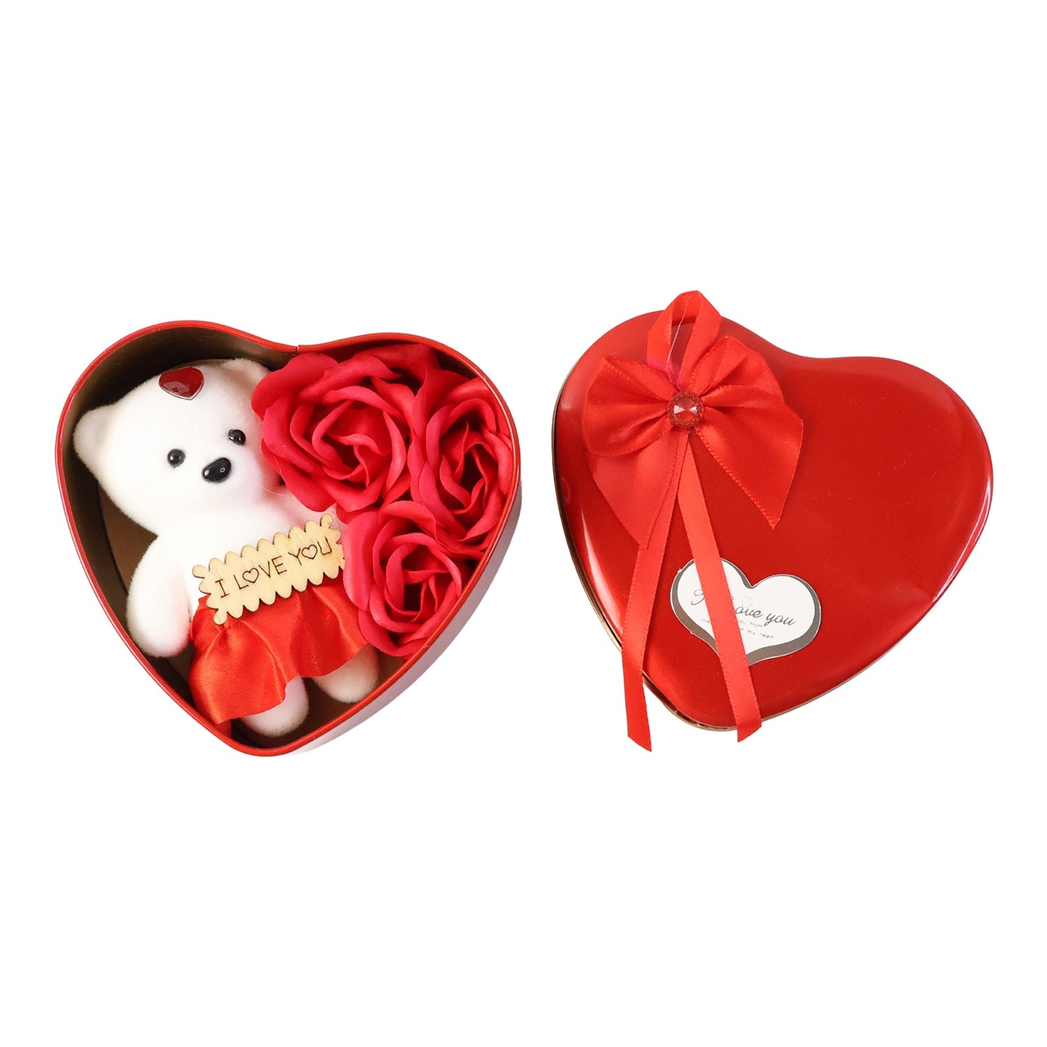 Close-up of teddy bear and roses in heart shaped gift box