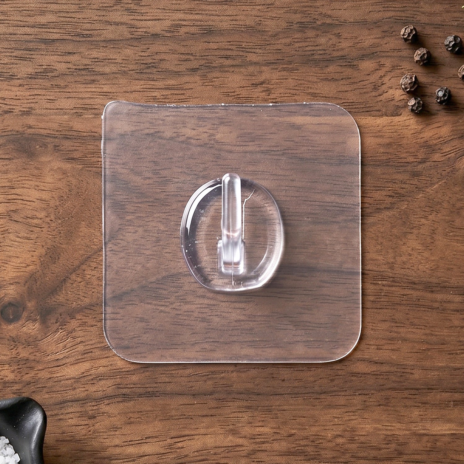 Clear Stick-On Wall Hook in use