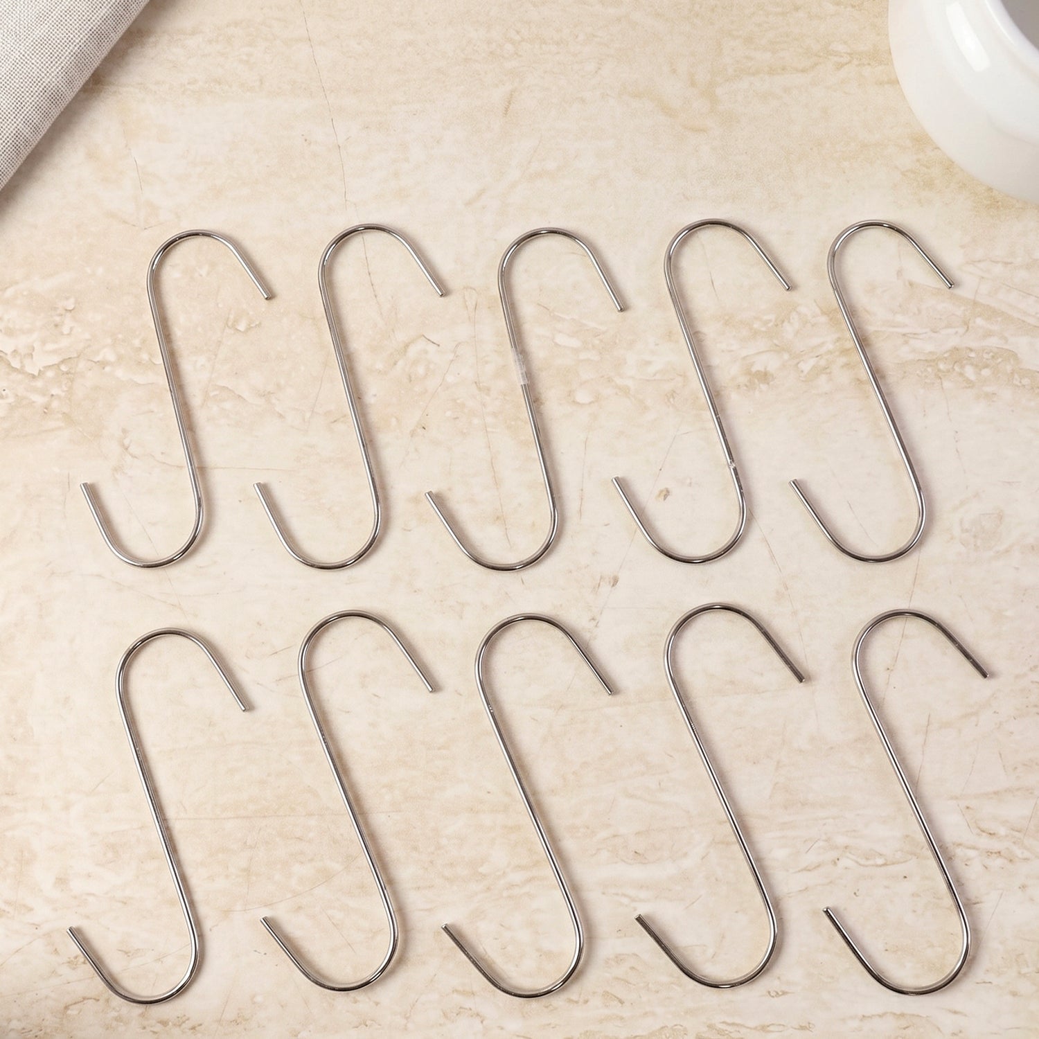 Organized kitchen using heavy-duty S-hooks for utensils and pans.