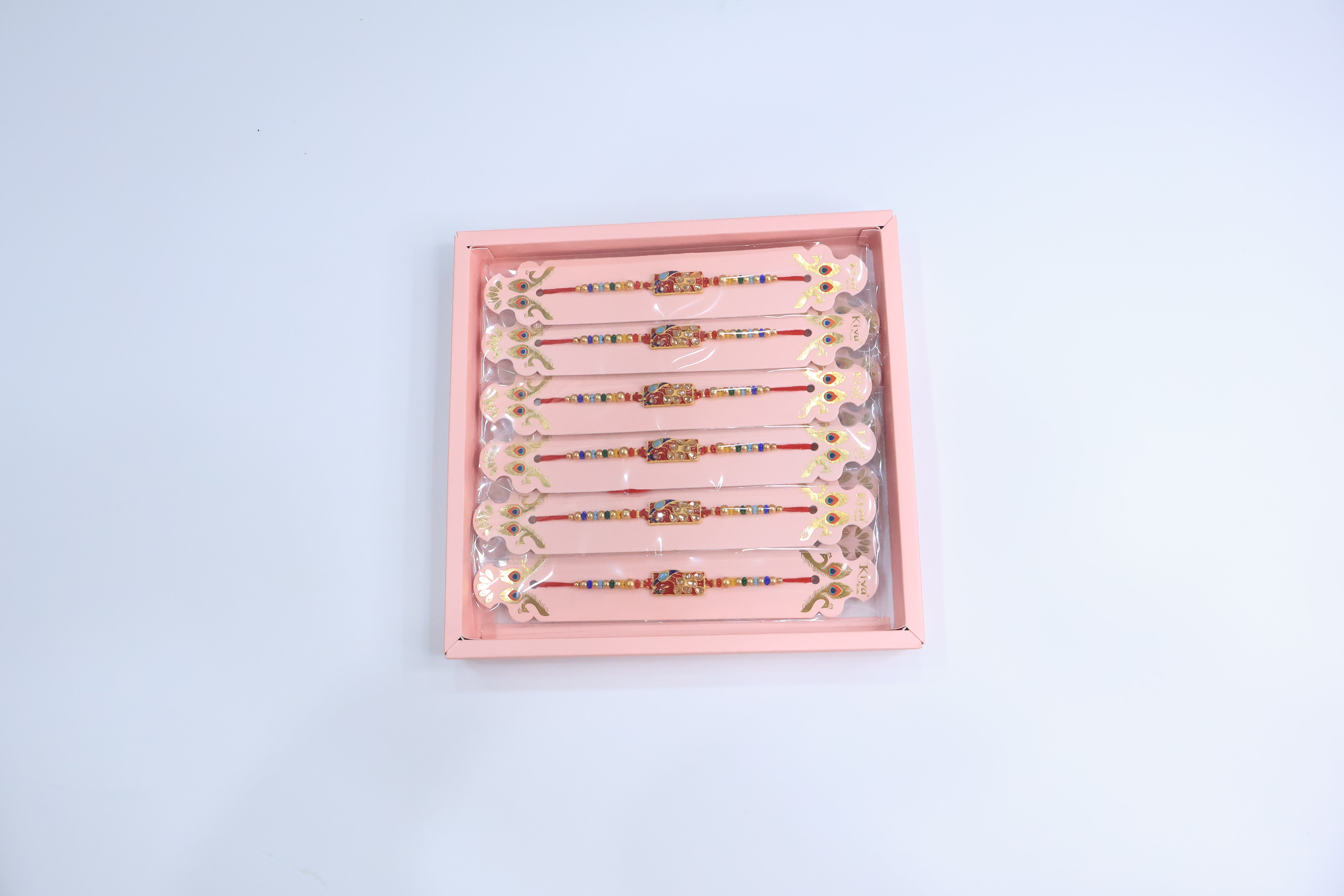 12 Pc Designer Peacock Kundan Rakhi Set with Red Enamel Dial and Multicolor Beads â€“ Premium Traditional Gift Box for Raksha Bandhan