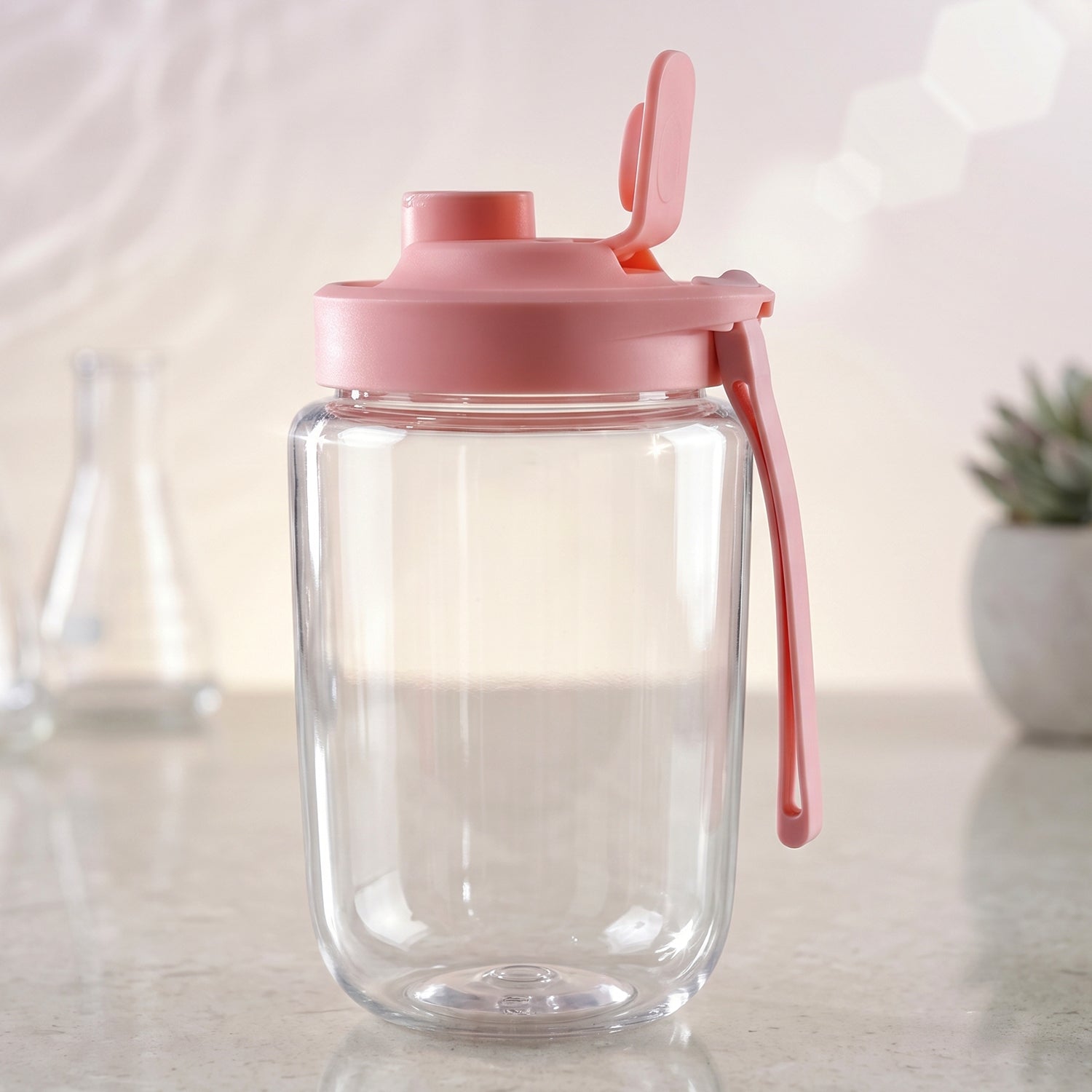 Portable electric juicer in use blending fruits in the compact cup
