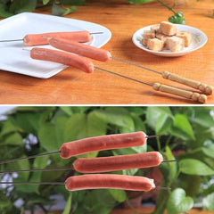 Close-up of barbecue skewers with wooden handles on grill
