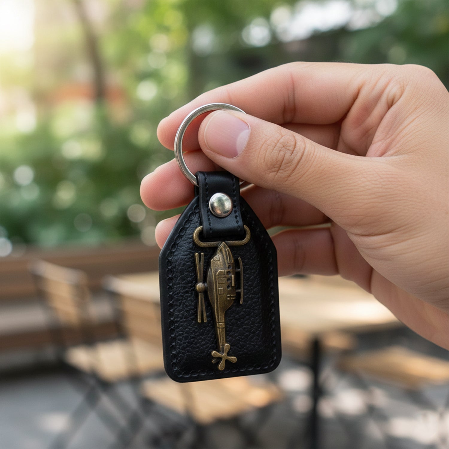 Back view of leather and metal sword keychain