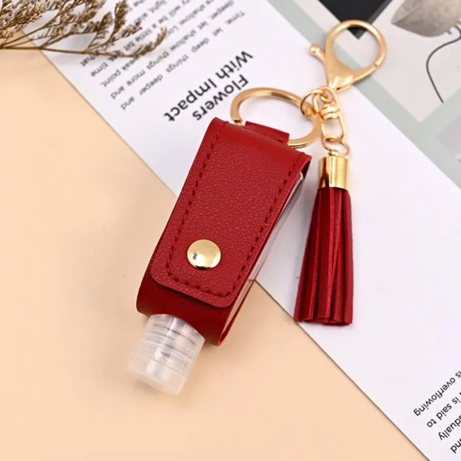 Stylish hand sanitizer pouch with keyring and snap closure