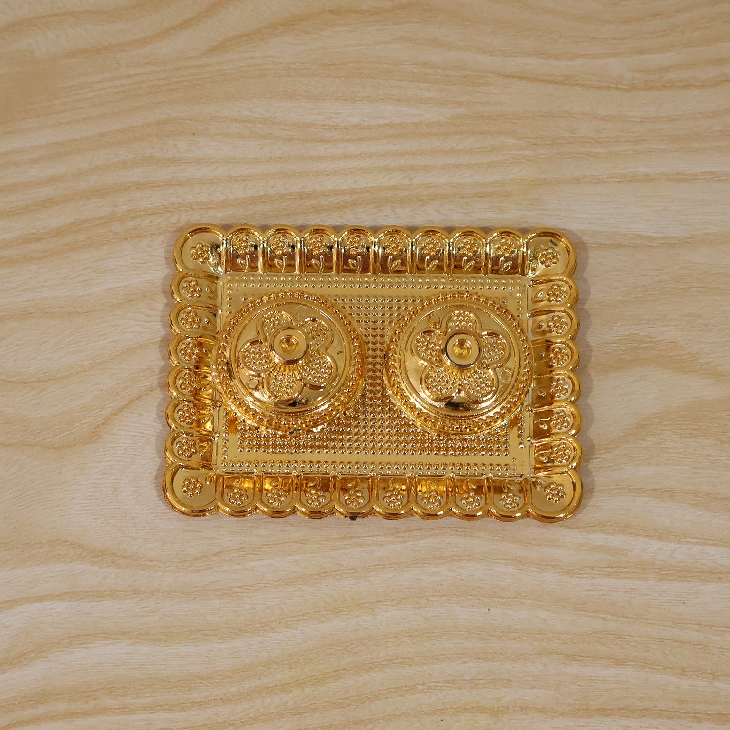 Elegant gold kumkum holder, perfect for gifting during religious events