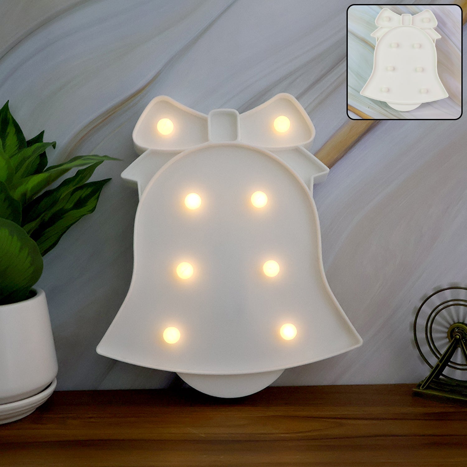 Bell Shaped LED Decorative Night Light glowing pink on table