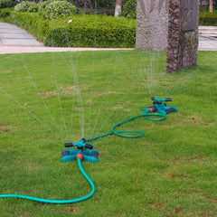 Blue and black garden sprinkler with 3 arms for efficient irrigation
