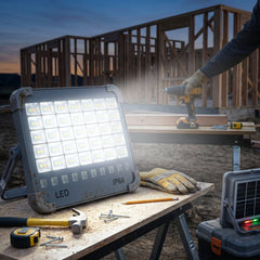 Compact waterproof LED flood light with handle and magnetic back for camping and emergencies