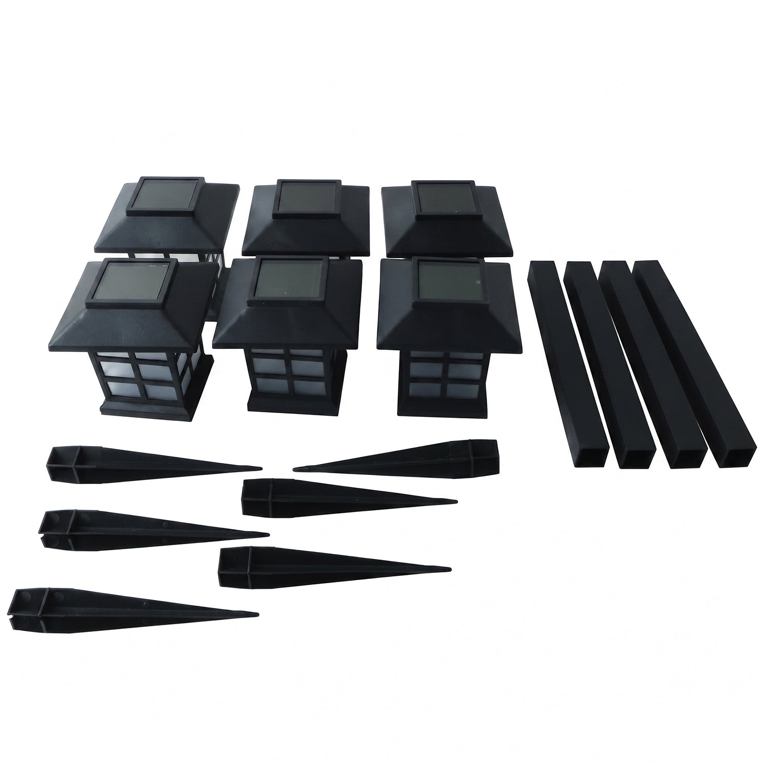 The unassembled components of six black solar garden lights are arranged on a white background.