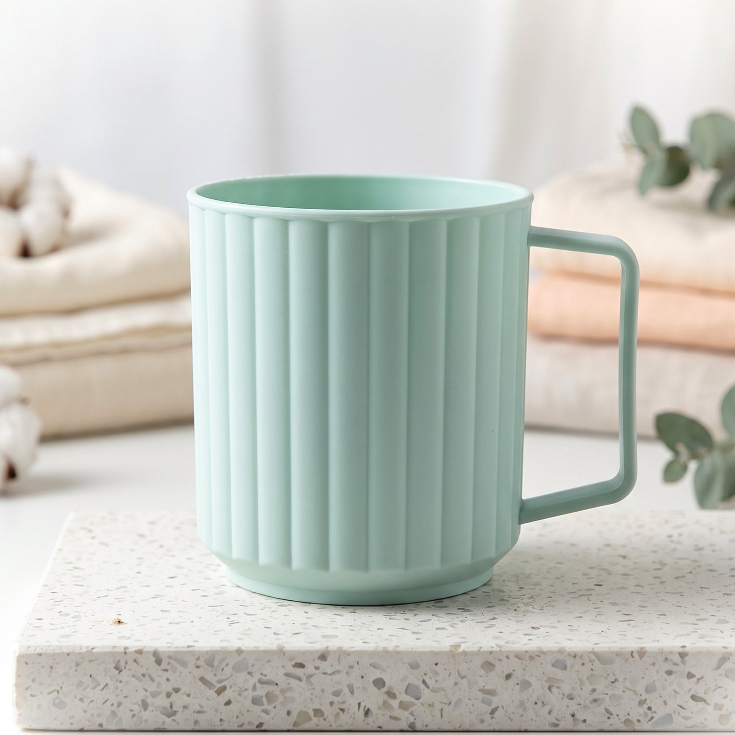Plastic mug filled with hot coffee