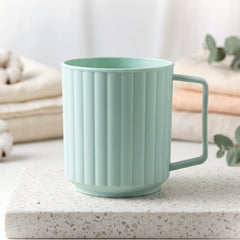 Plastic mug filled with hot coffee