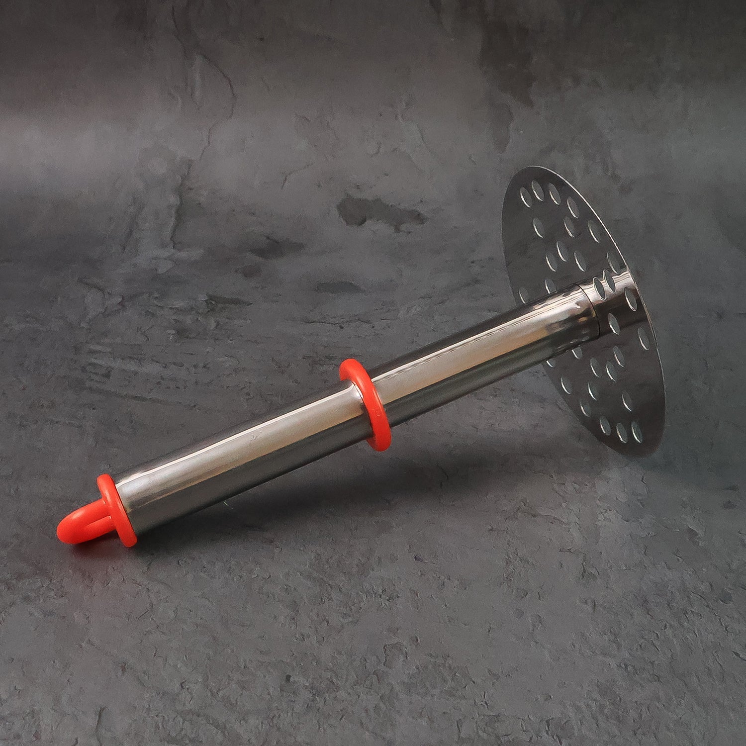 Potato masher being held for comfortable mashing action