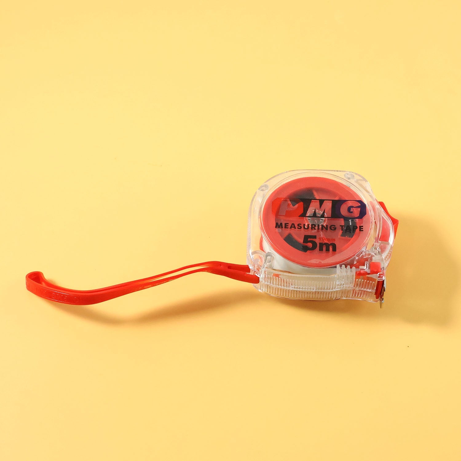 Measuring tape on plain background