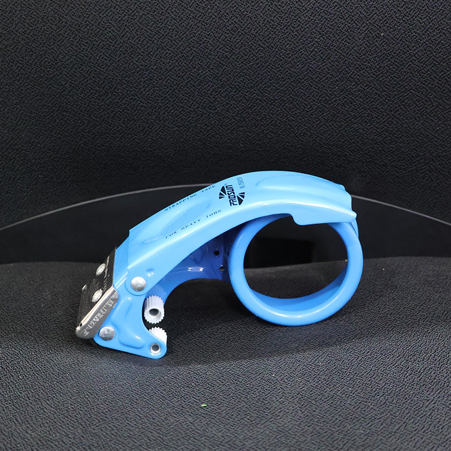 Packaging tape and metal tape dispenser on table