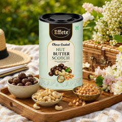 Effete Choco Coated Nut Butterscotch Chocolate pieces arranged artfully on a dark surface.