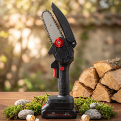 Gloved hand operating a black and red mini chainsaw, cutting a tree branch with wood chips flying.