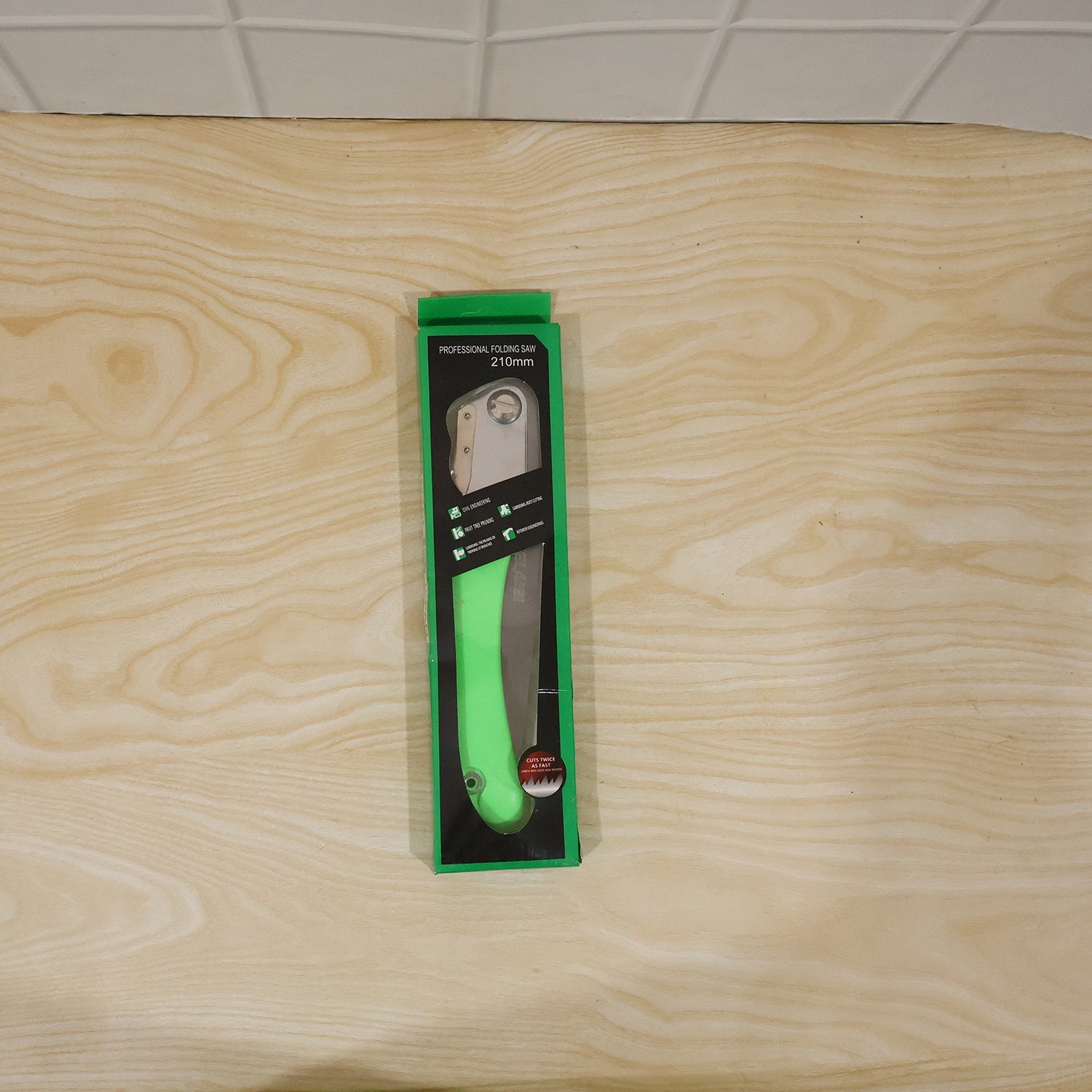 Full view of garden folding saw with blade extended for pruning and wood cutting