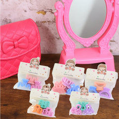 Girls wearing colorful mini hair clips styled in hair