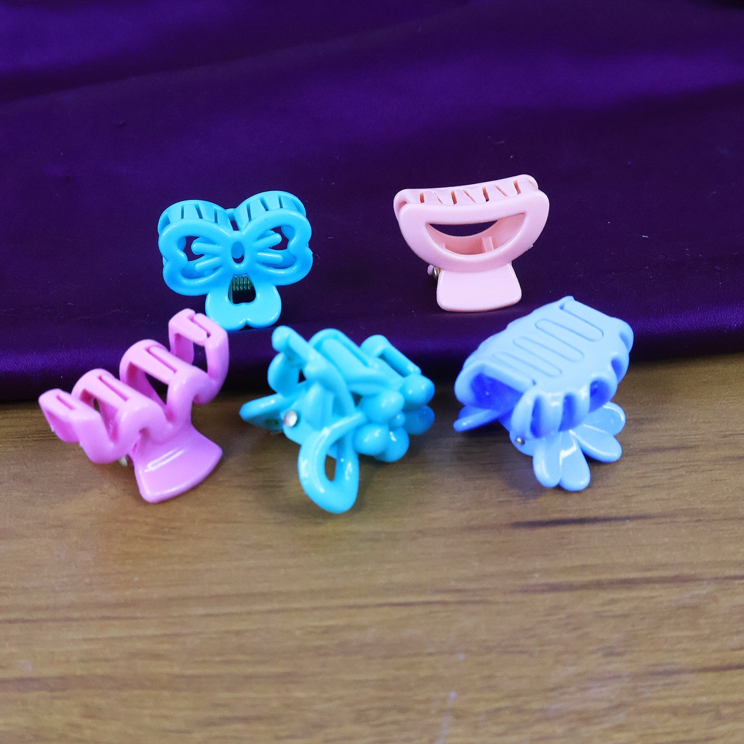 Mini hair claw clips arranged showing mix colors