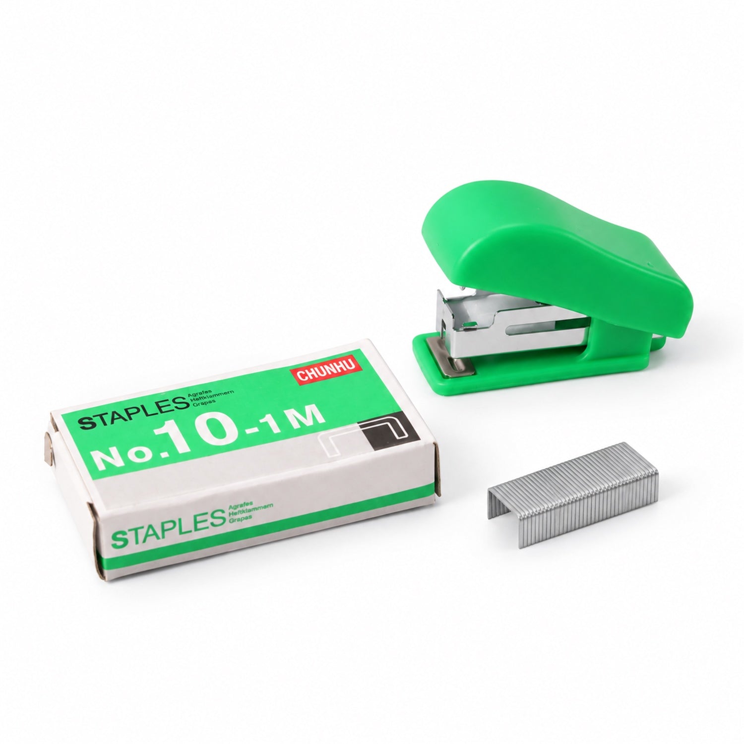 A bright green stapler, a box of No. 10 staples, and a strip of metal staples are arranged on a clean white surface.
