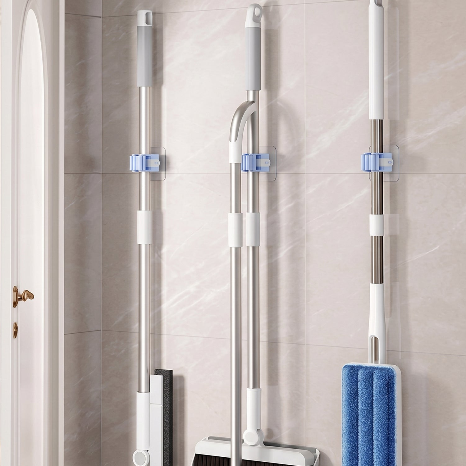 A mop securely held by the self-adhesive wall mounted gripper.