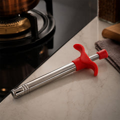 Gas lighter igniting a stove burner
