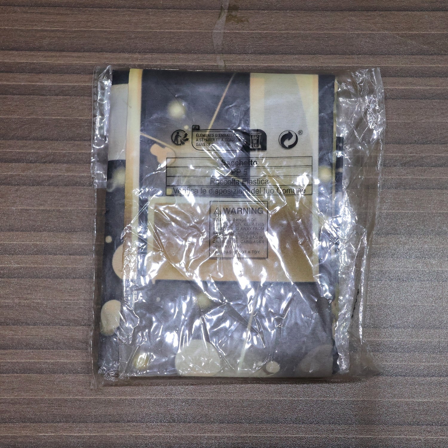 Folded New Year printed backdrop in clear plastic packaging