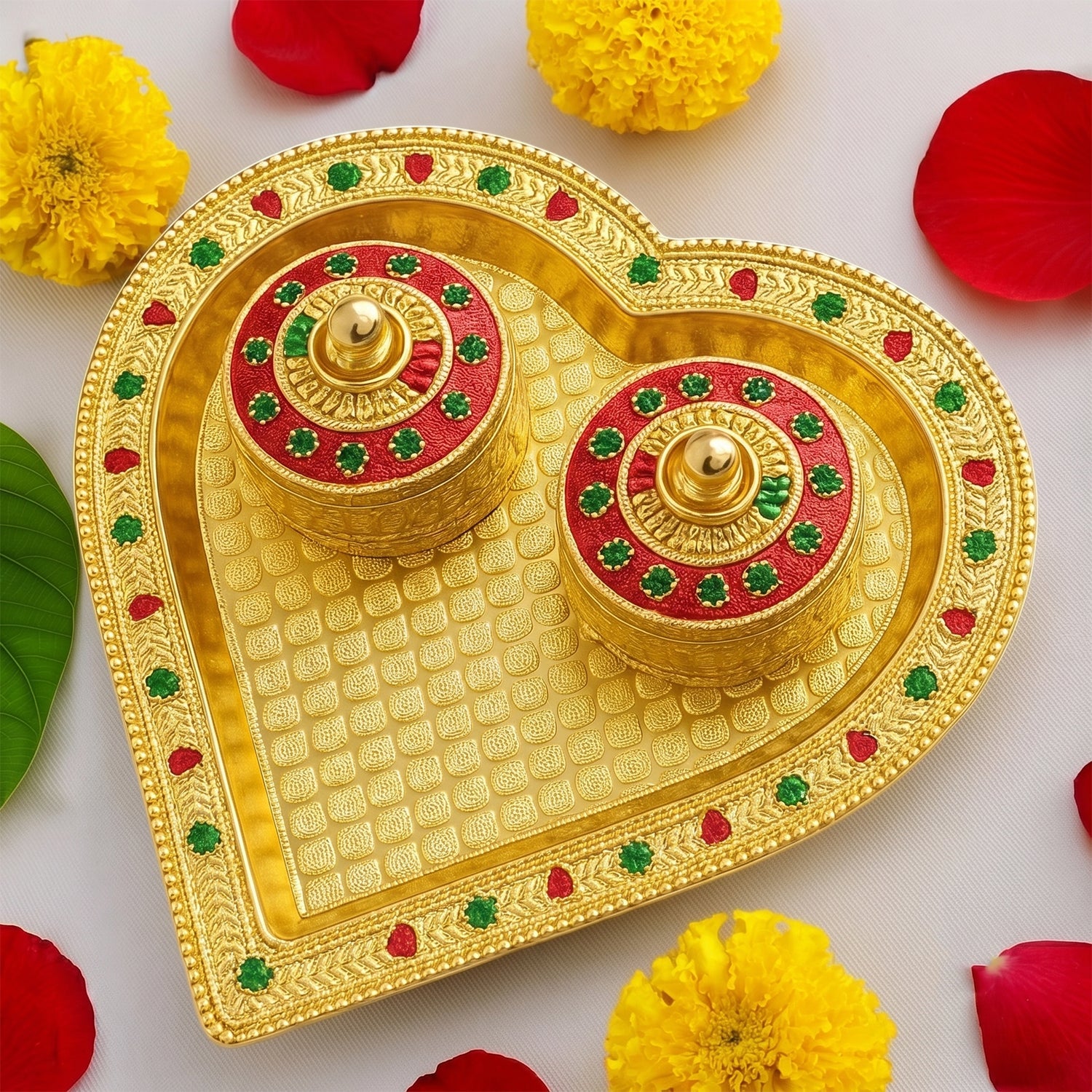 Traditional golden kumkum holder with meenakari floral lid for religious ceremonies