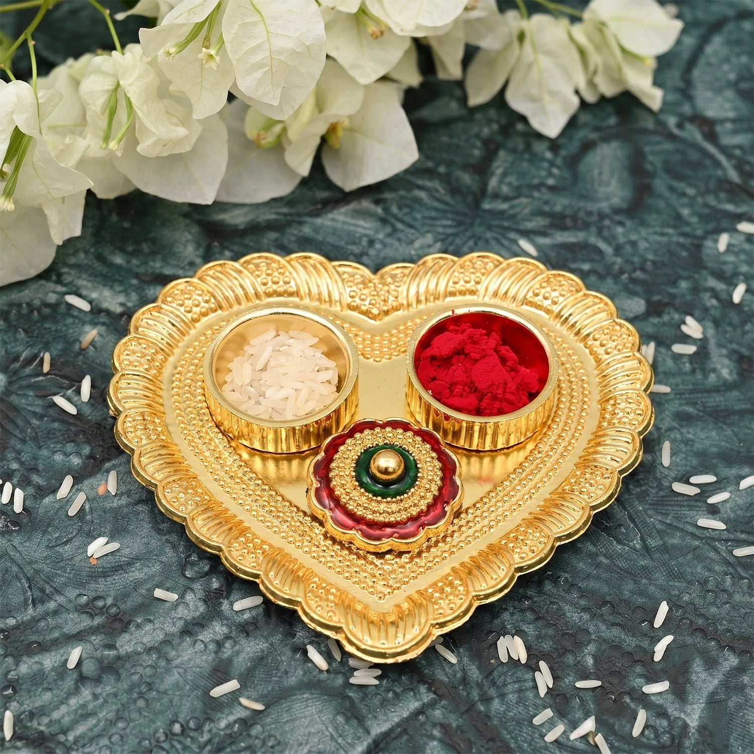 Organized storage of kumkum, roli, haldi, and chandan in a heart-shaped pooja box
