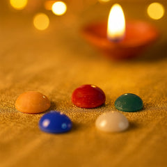 Five polished Panch Ratna stones arranged on display