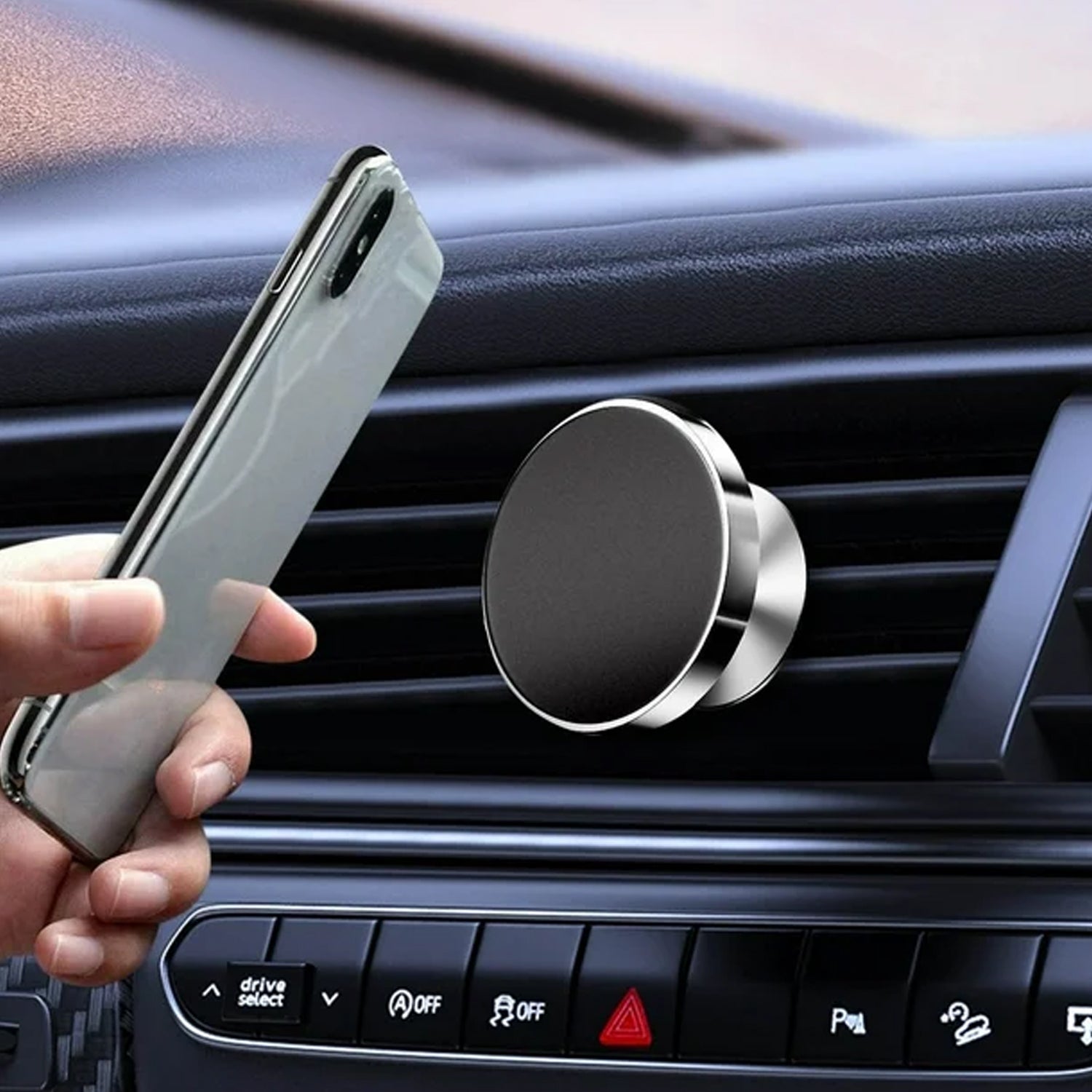 Magnetic phone holder supporting smartphone on dashboard