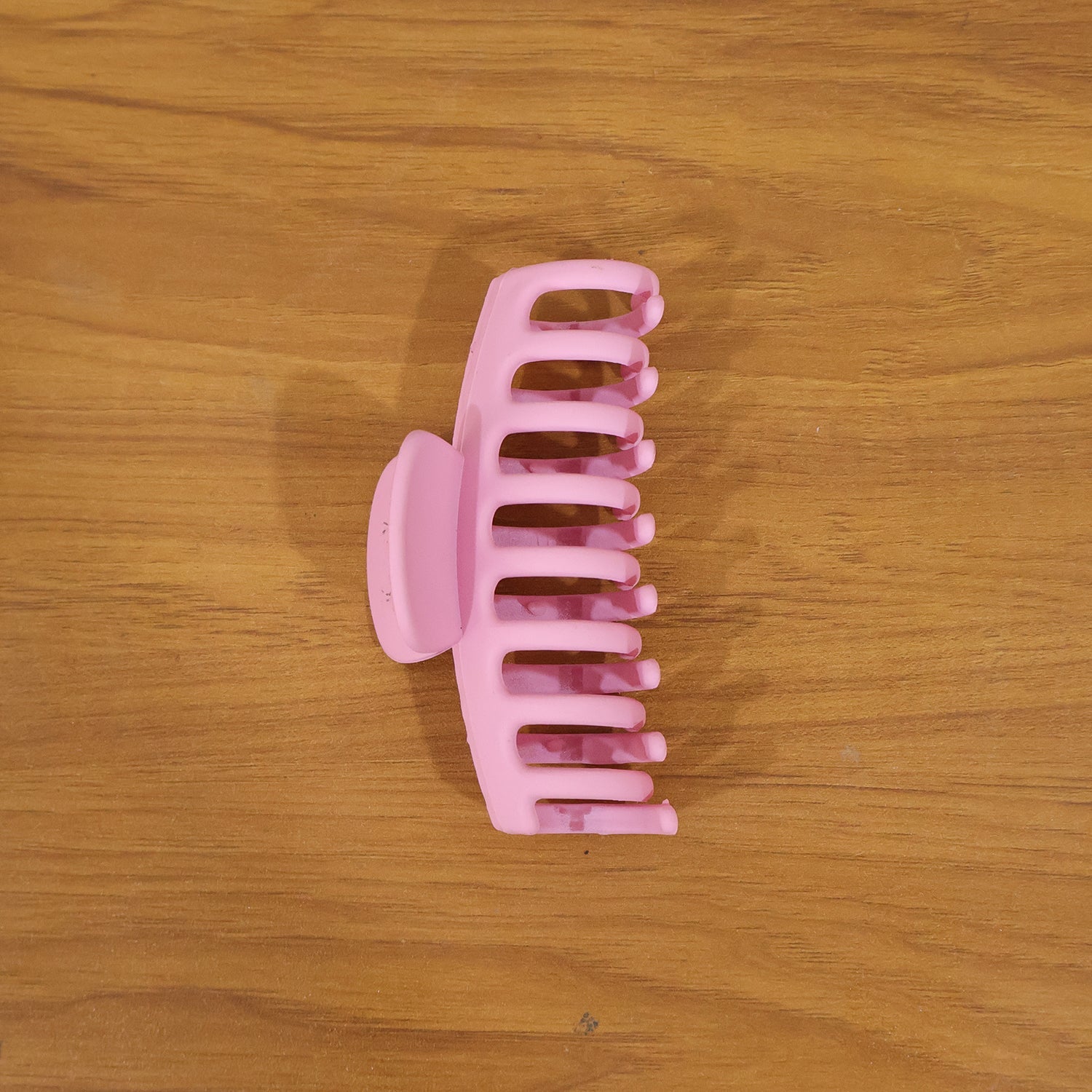 Model wearing elegant pink hair claw clip