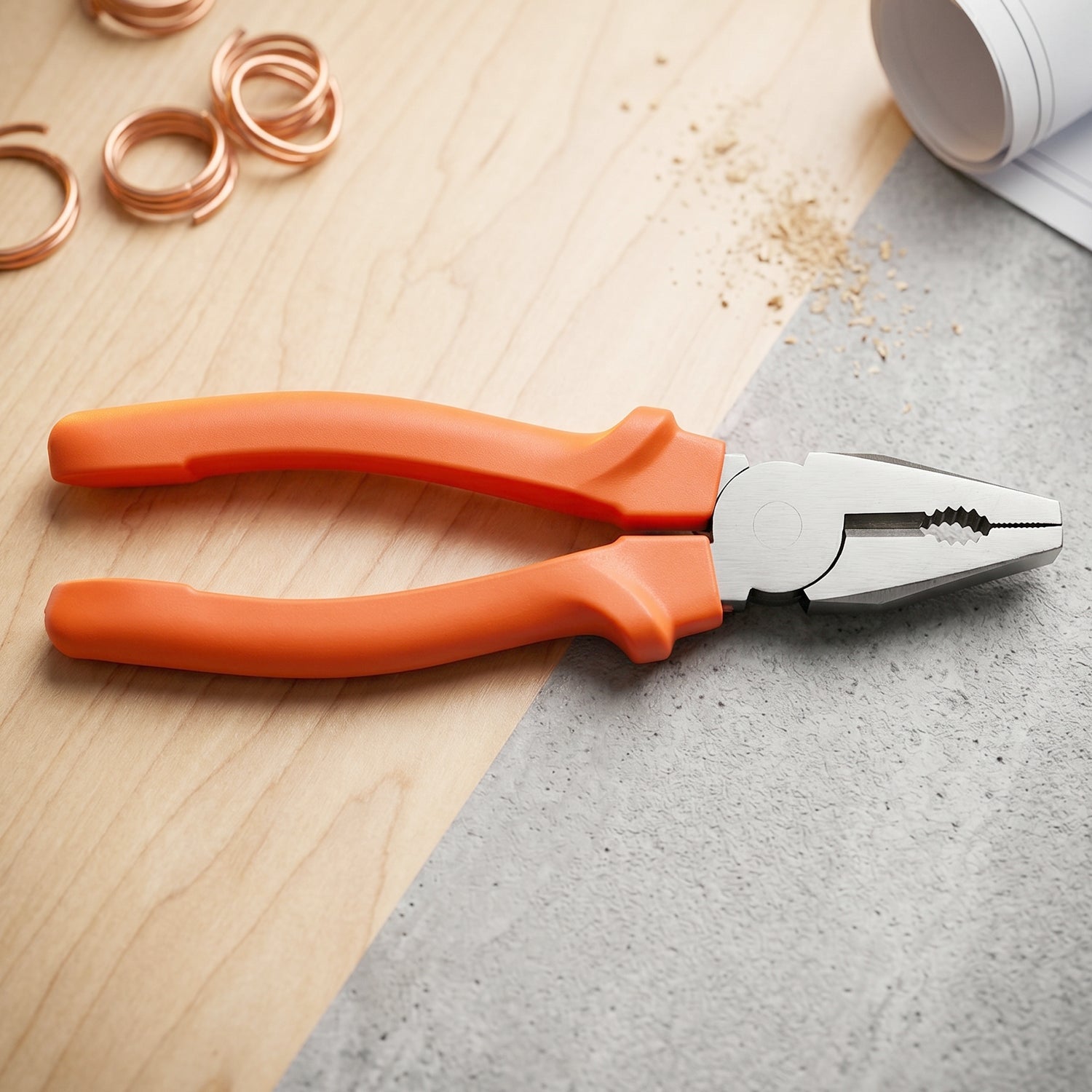 Close-up of combination pliers showing serrated gripping surface and built-in wire cutter
