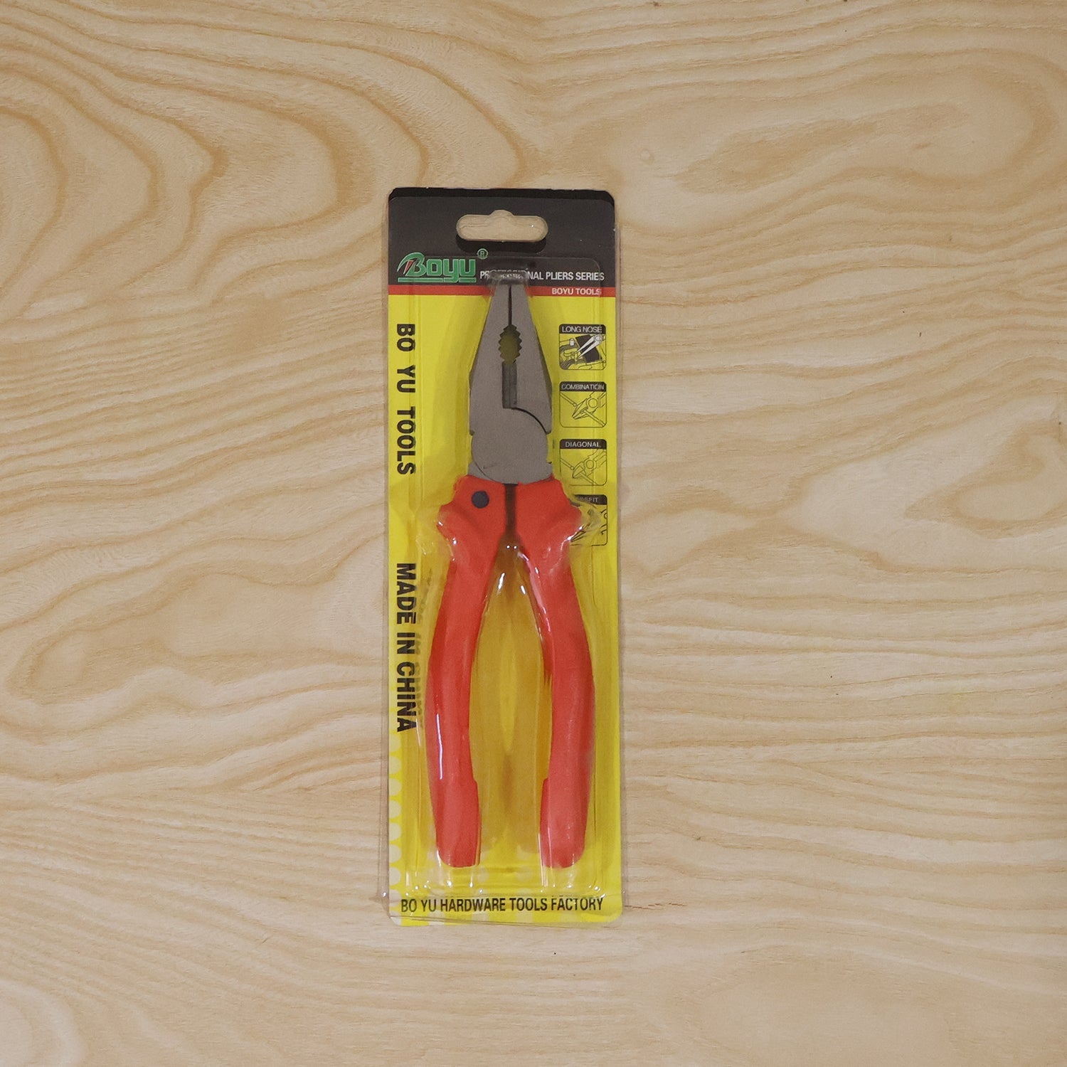 Close-up of pliers gripping wire, demonstrating serrated surface and insulated handles