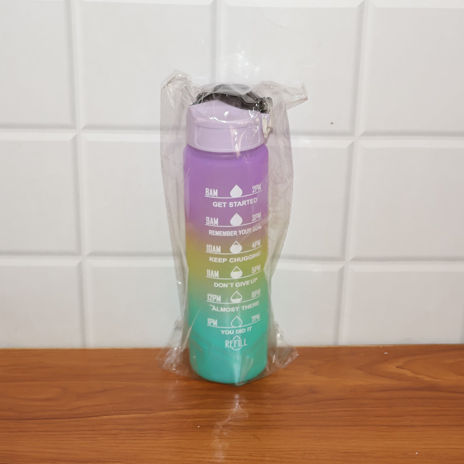 Motivational Water Bottle lifestyle image with gym gear