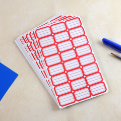 Red rectangular self-adhesive label sheet