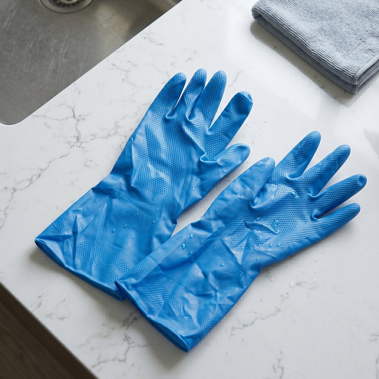 Blue gloves used for household cleaning