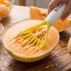 Melon cutter slicing through a watermelon