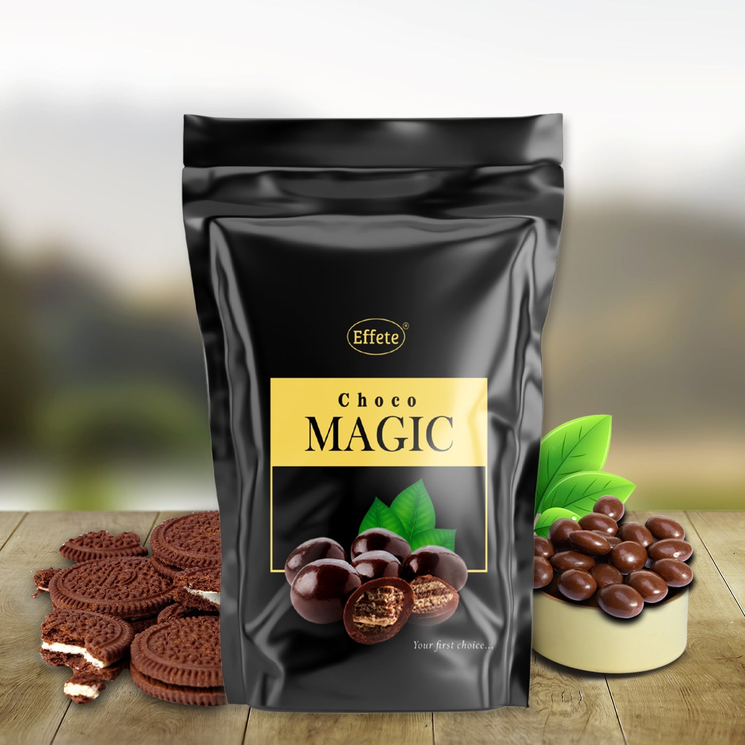 Black "Choco Magic" pouch on a wooden table with chocolate sandwich cookies and a bowl of chocolate candies.