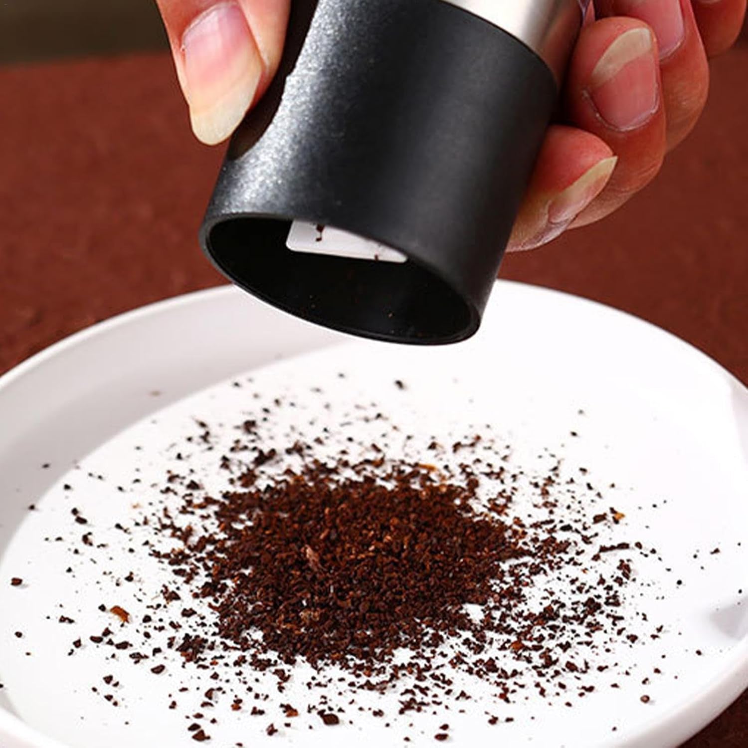 Stylish stainless steel salt and pepper grinder on countertop