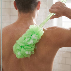 Soft mesh loofah on extended handle for gentle exfoliation