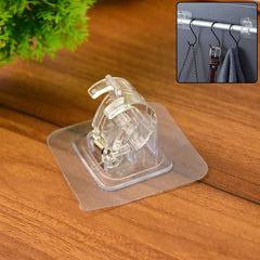 Transparent self-adhesive wall hook mounted on a smooth wall