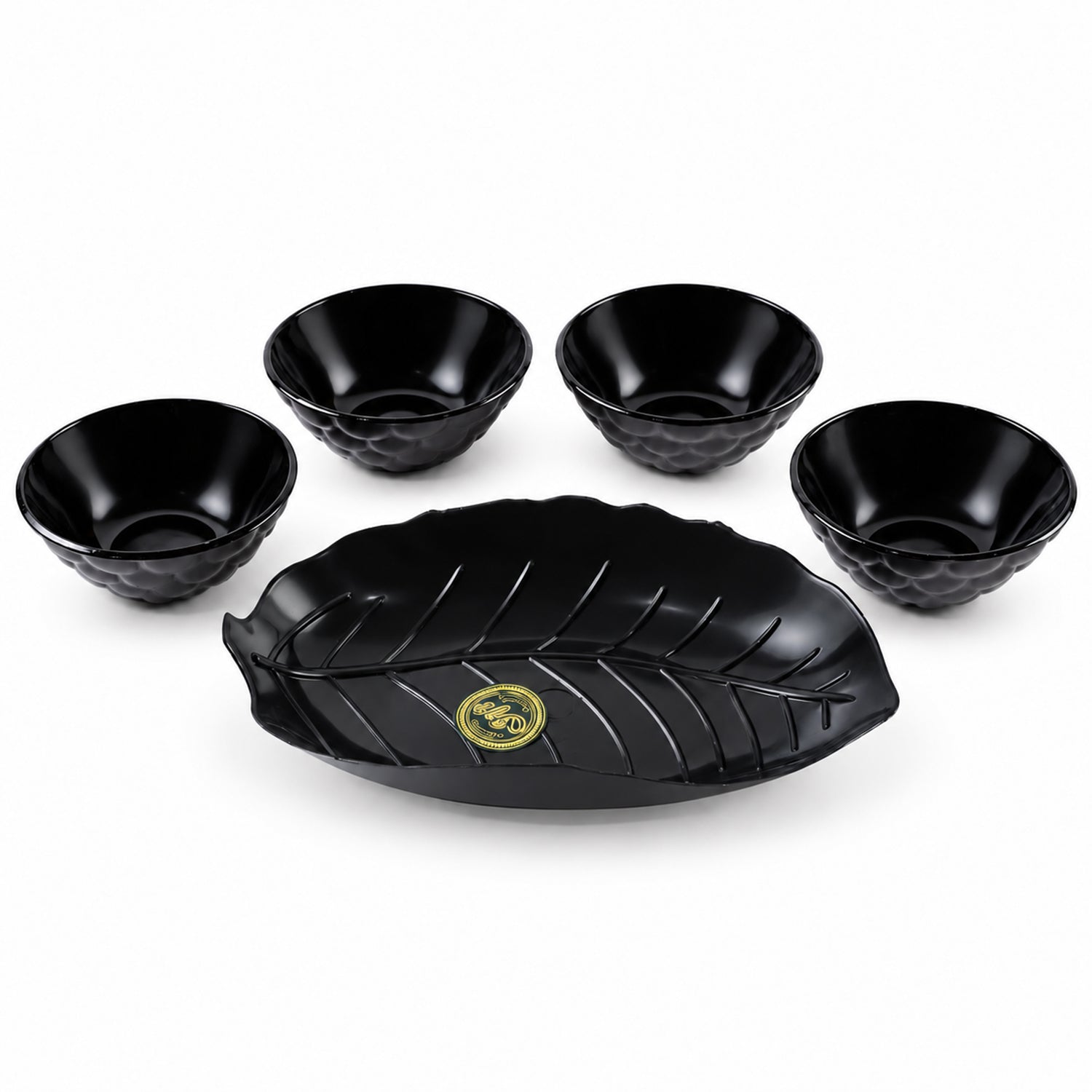 A black leaf-shaped platter and four small black bowls with textured exteriors are arranged on a white background.